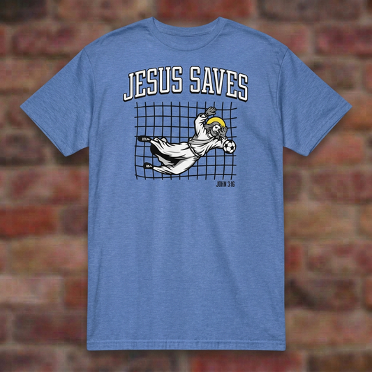 Jesus Saves Soccer T-shirt in Heather Royal, flat lay on blurred brick