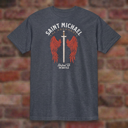 St. Michael Defend Us In Battle T-shirt in Heather Navy, flat lay on blurred brick