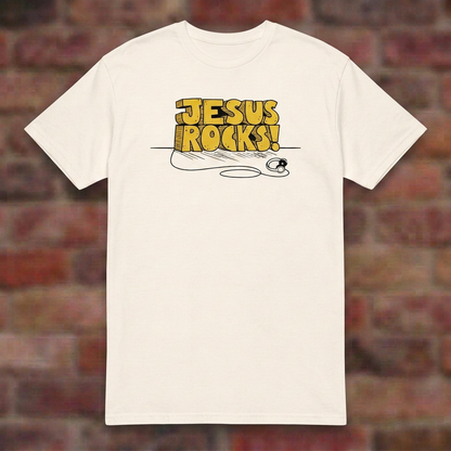 Jesus Rocks T-shirt in Natural, flat lay on blurred brick